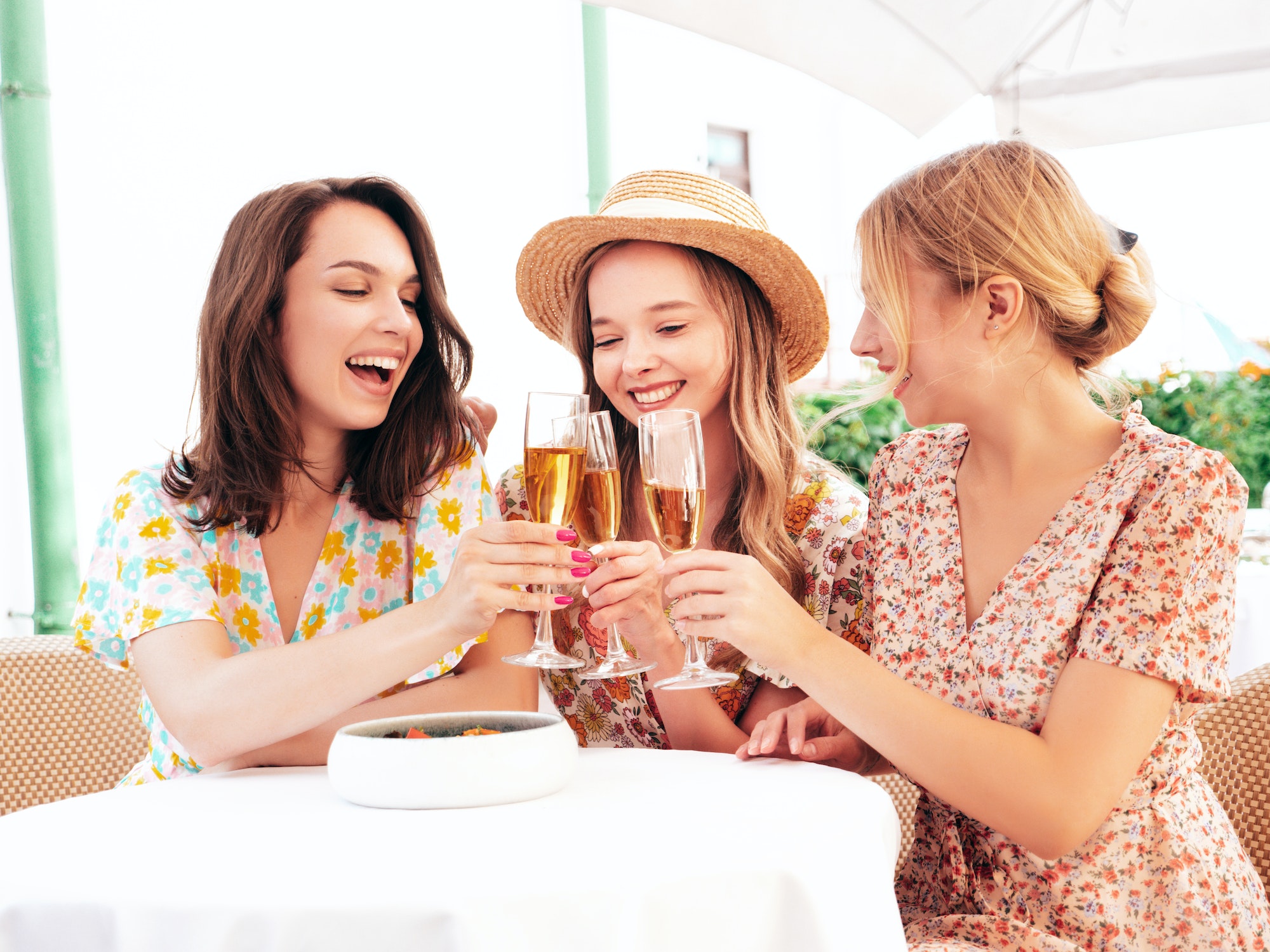 Three beautiful women posing outdoors